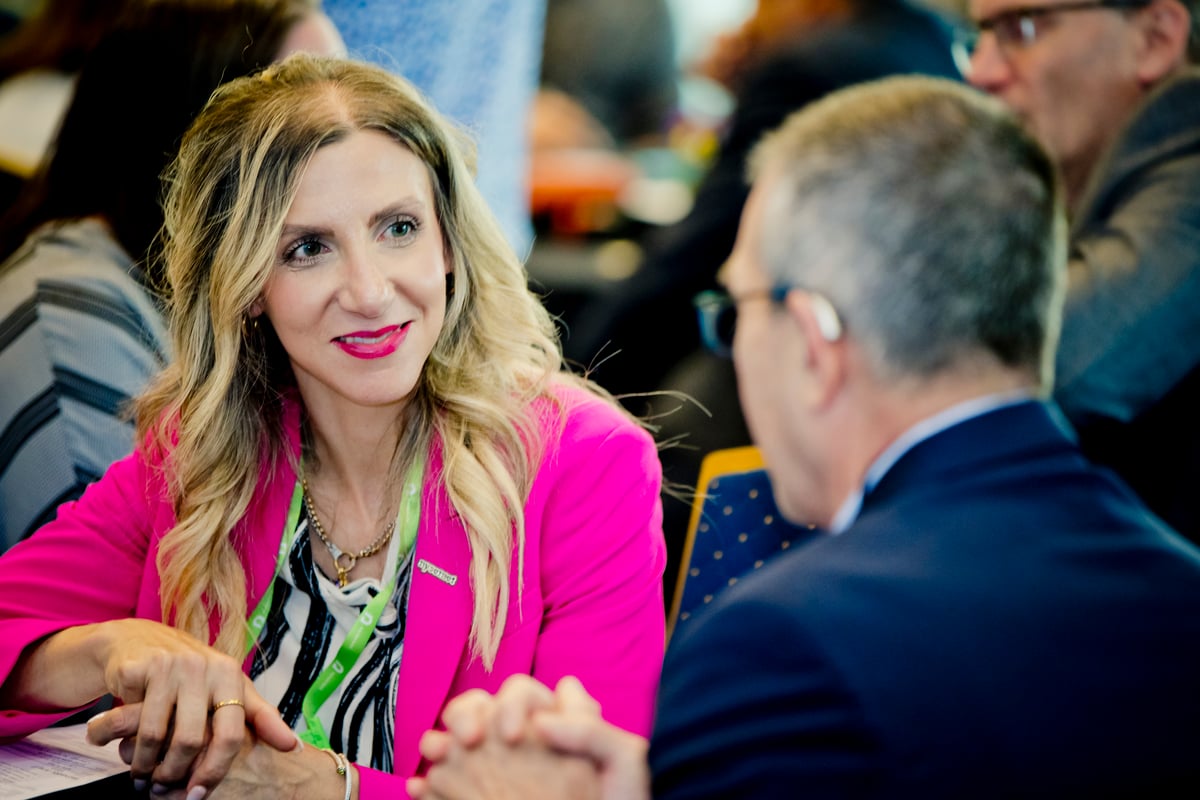 Chief Information Security Officer Emilyann Fogarty engages in discussion with a Nysernet member.