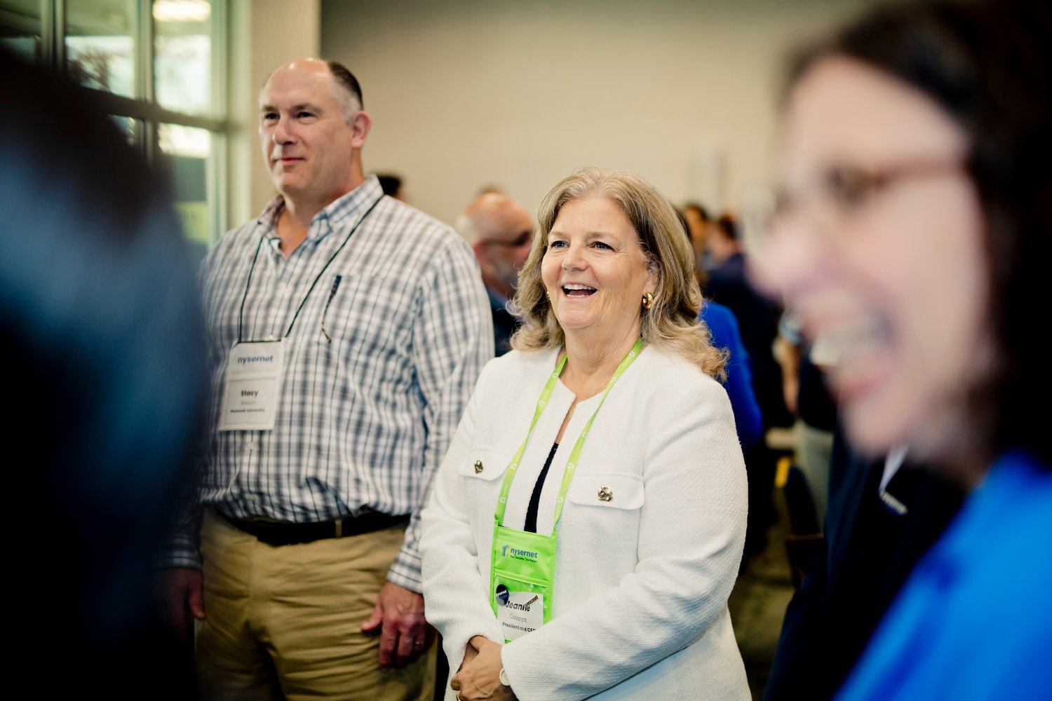 Nysernet Chief Information Officer Jeanne Casares stands among members at NYSCIO engaging in a team building activity.